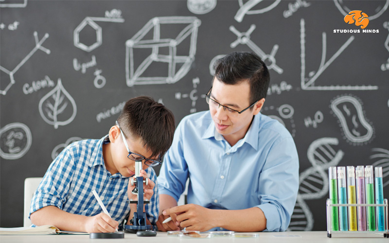 Asian Chemistry Tutor Teaching Chemistry To A Student